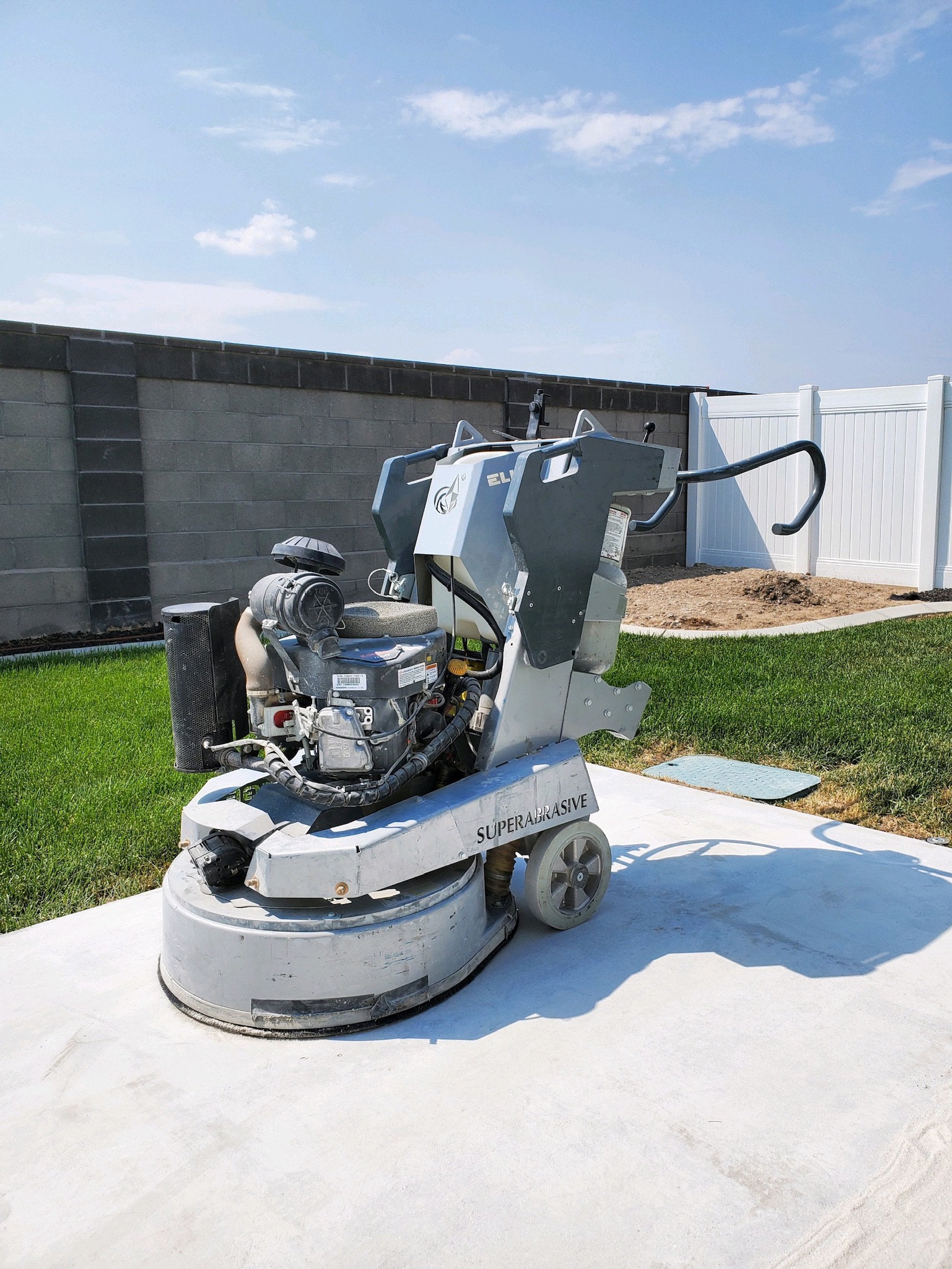 Superabrasive diamond grinder prepping exterior patio concrete - Sparks Coatings